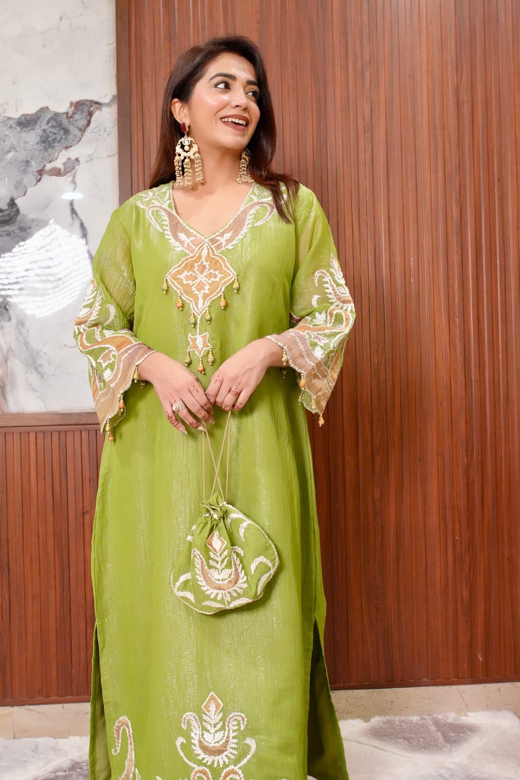 Aaira Royal Embroidered Set with Potli Bag.